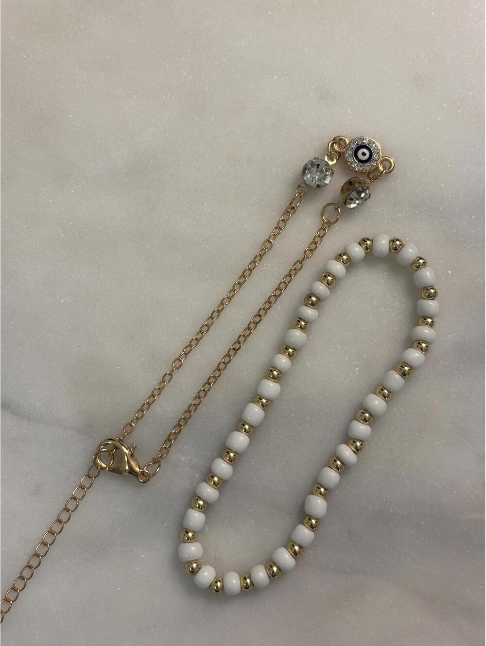Elegant Gold and White Beaded Necklace with Evil Eye Charm